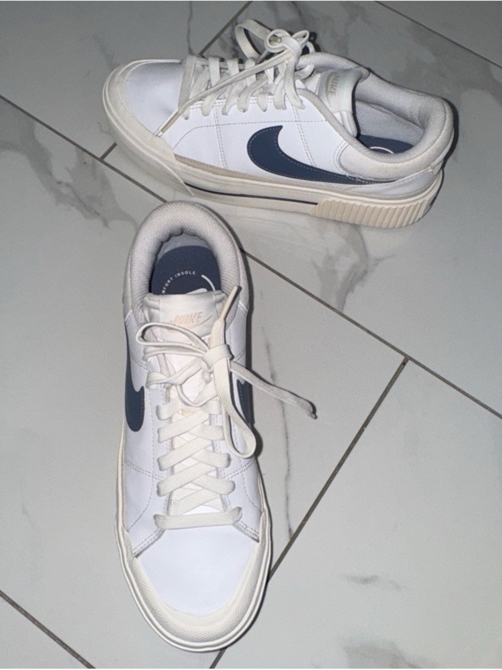 Nike Woman’s White Sneakers with Navy Swoosh Accent